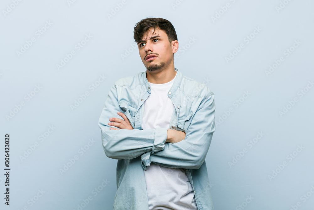 Young hispanic cool man tired of a repetitive task. Young hispanic cool man tired of a repetitive task.