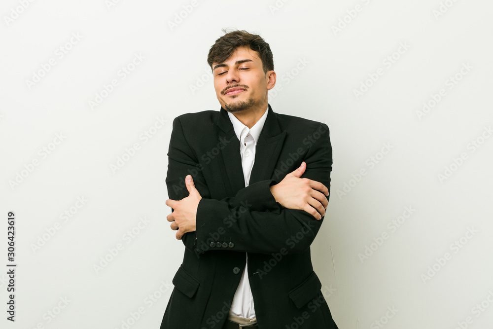Young business hispanic man hugs, smiling carefree and happy. Young business hispanic man hugs, smiling carefree and happy.