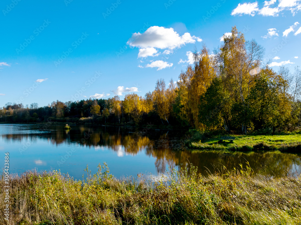 Obraz premium colorful autumn landscape by the lake, golden autumn, colorful trees and reflections