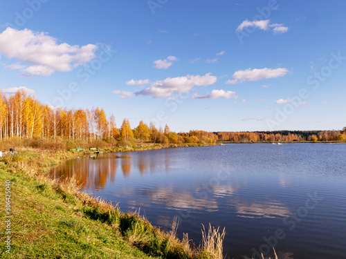 colorful autumn landscape by the lake, golden autumn, colorful trees and reflections