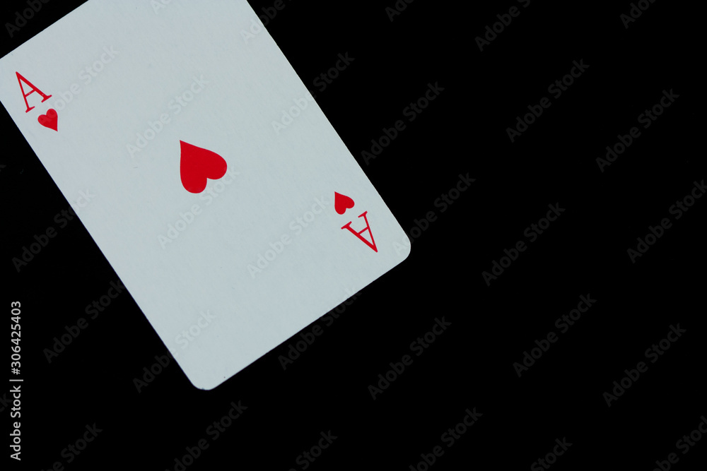 Ace of hearts. Playing card isolated on black background.