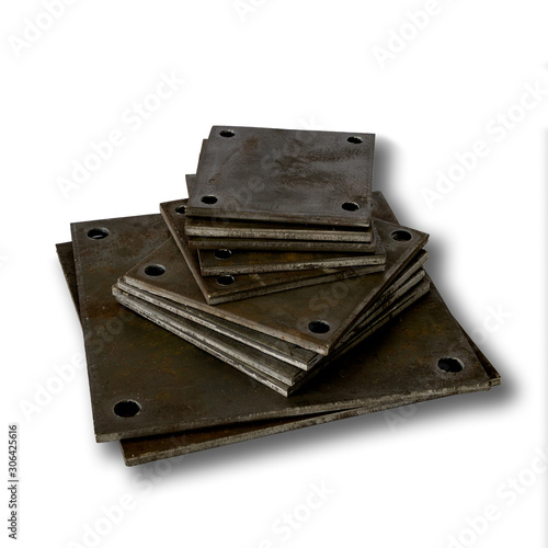 various sizes of square steel base plate with holes at each corner used with anchor bolts for installing steel column in building construction. isolated on white background.