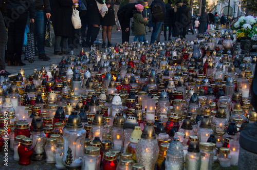 Wallpaper Mural Monument and candles in the cemetery. All Saints Day in Poland. A lot of funeral candles. Torontodigital.ca