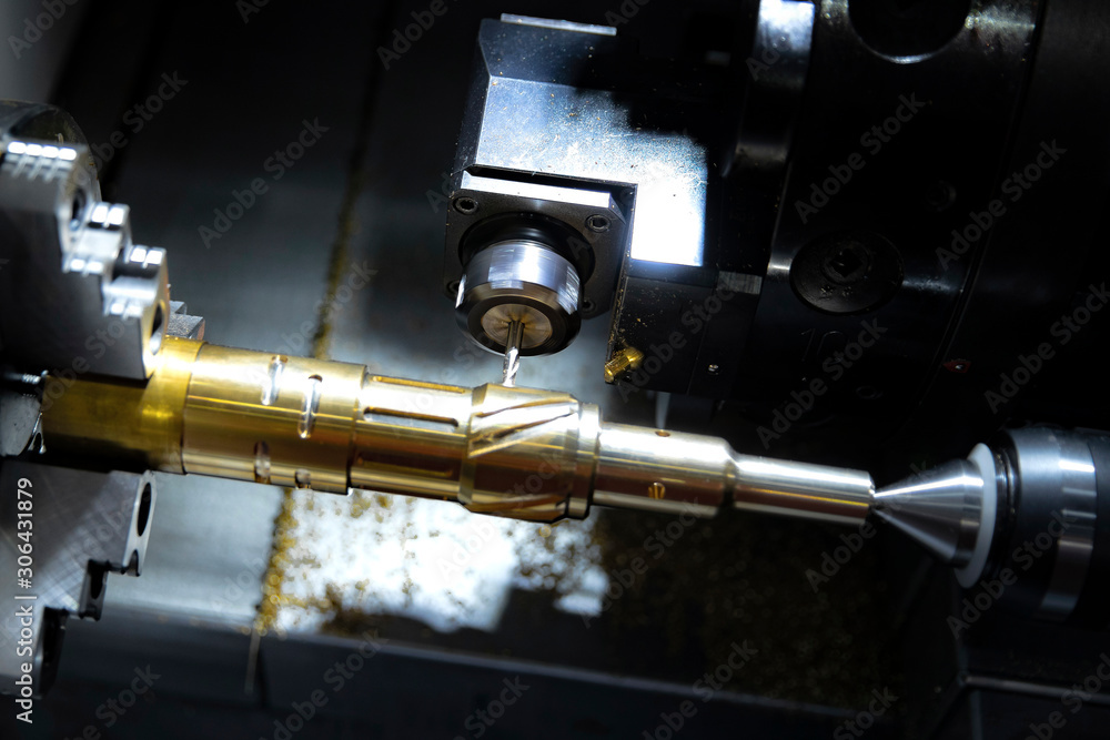 Fototapeta premium Milling and drilling machine working process High precision CNC in the metalworking plant, working process in the steel industry.