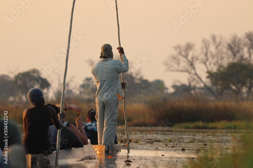 With mokoro in the Okavango Delta in Botswana on holiday. Travelling in summer during dry season. photo