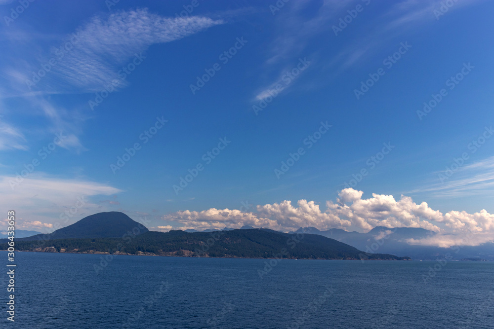 Beautiful cloud scape on the Thick white clouds drift over the mountain on the Pacific Ocean, BC, Canada Beautiful cloud scape on the Thick white clouds drift over the mountain on the Pacific Ocean, BC, Canada