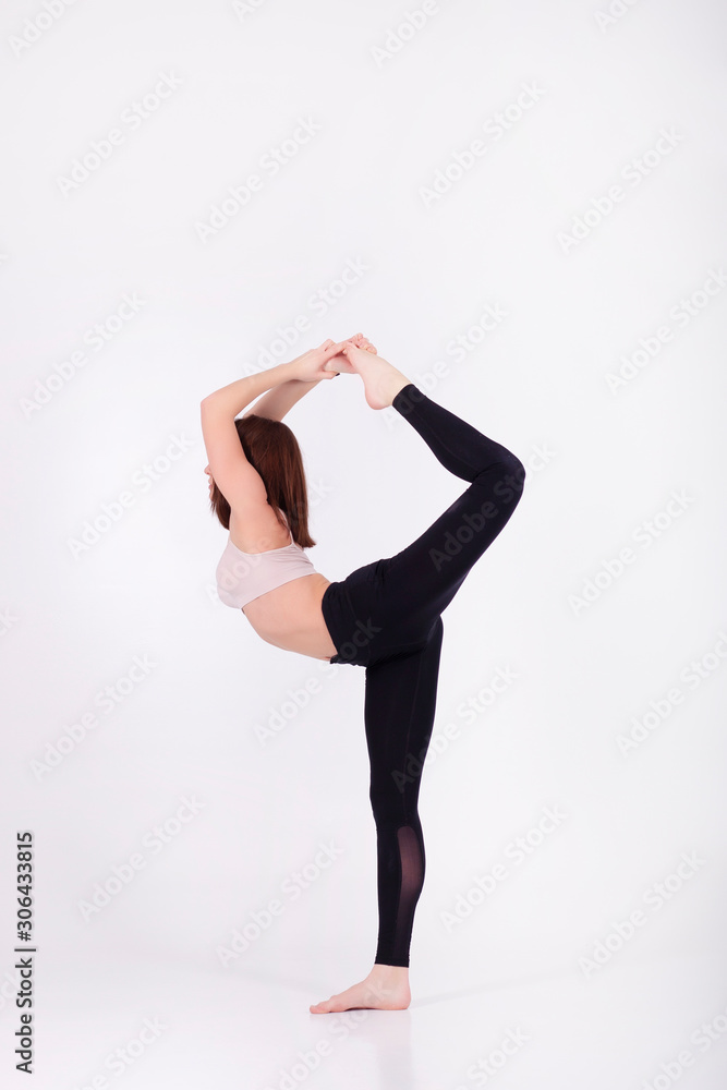 Young beautiful girl performs yoga exercises