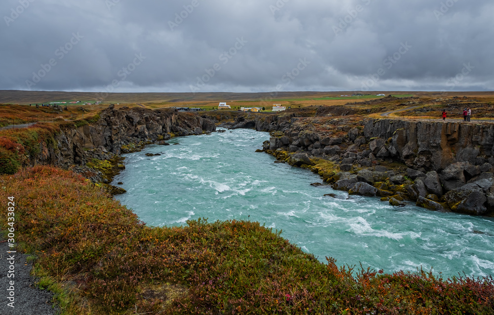 landscape of the Godafoss famous waterfall in Iceland. The breathtaking landscape of Godafoss waterfall attracts tourist to visit the Northeastern Region of Iceland. September 2019