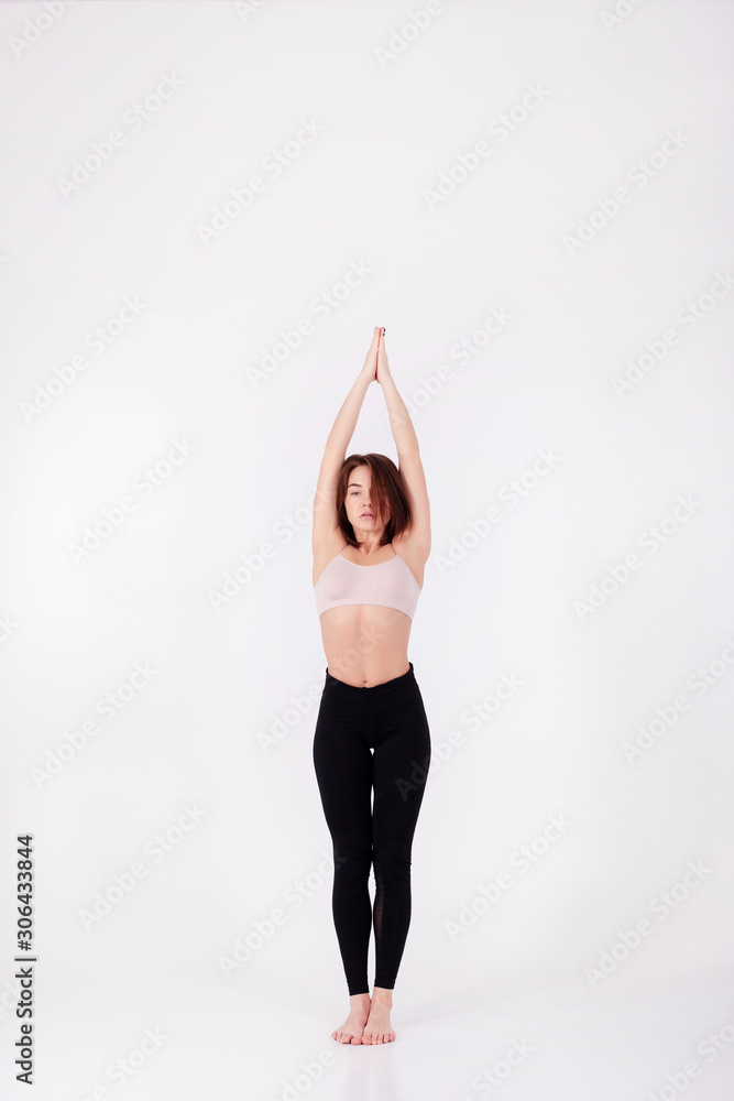 Young beautiful girl performs yoga exercises Young beautiful girl performs yoga exercises