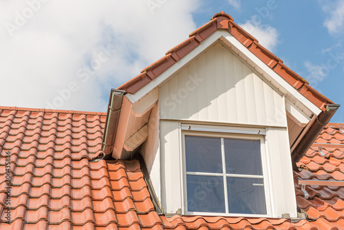 Dormer window with metal cladding in wood look
