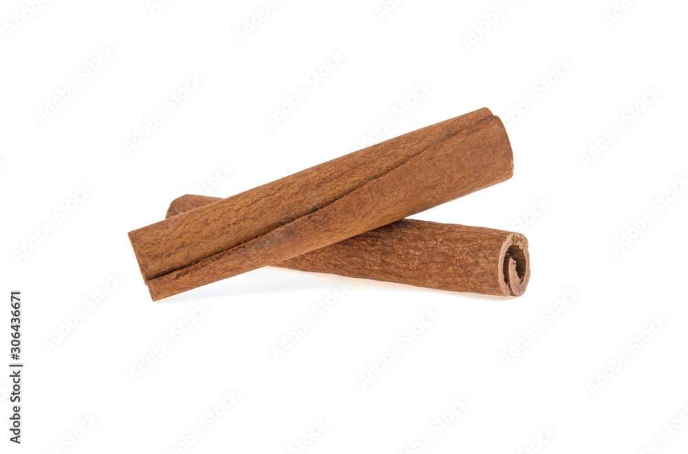 two cinnamon sticks on a white background isolated