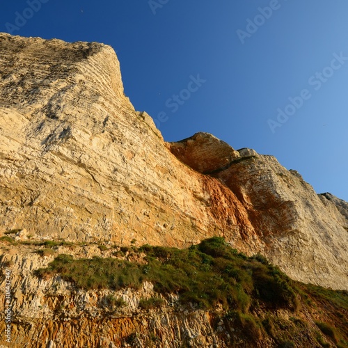 White cliffs on the beach of Fecamp, France photo