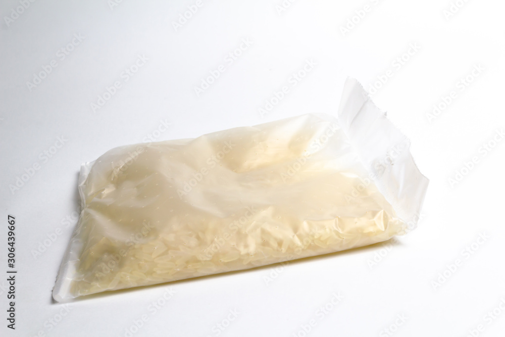 A bag of rice for instant cooking on a white background. A bag of rice for instant cooking on a white background.