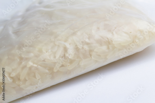 A bag of rice for instant cooking on a white background.