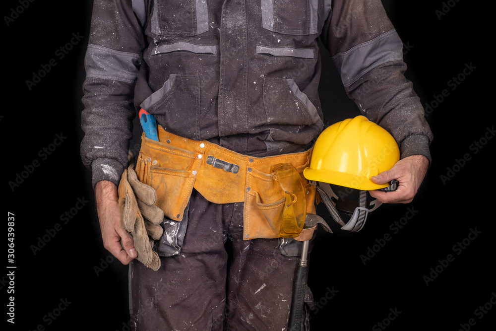 Painter holding a wall brush in his hand. Accessories for small home repairs. Painter holding a wall brush in his hand. Accessories for small home repairs.