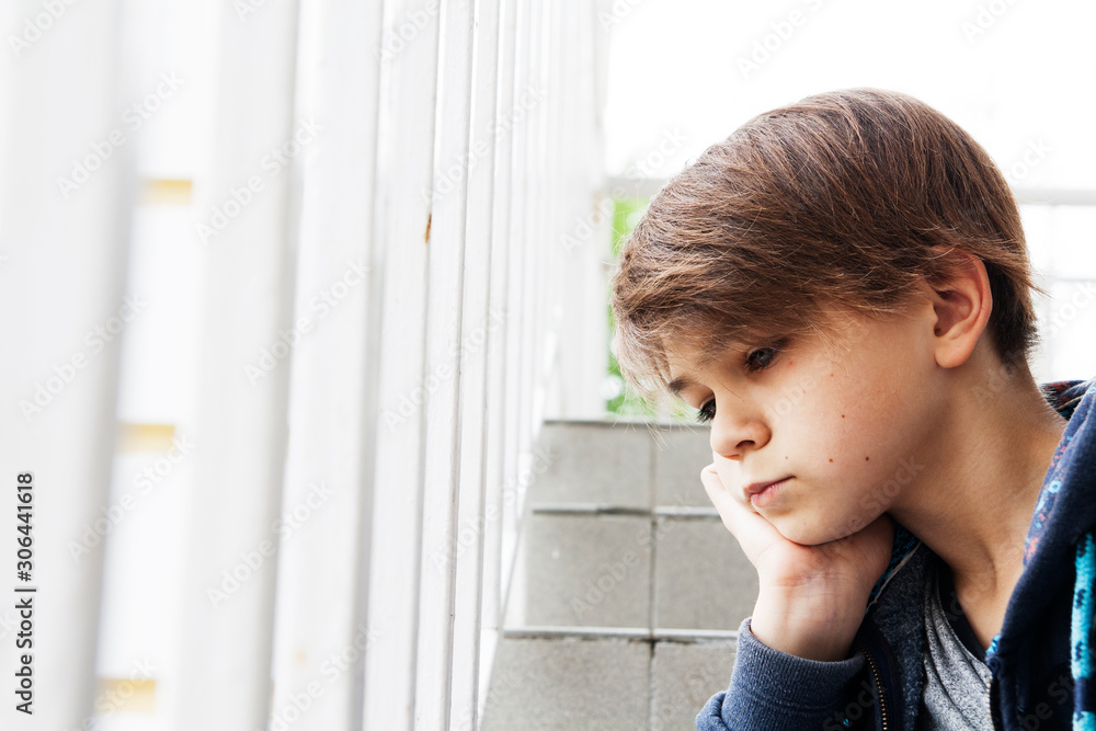 Portrait of a teenager with a puzzled expression on his face. The concept of youth, problems of the age of a teenager. Portrait of a teenager with a puzzled expression on his face. The concept of youth, problems of the age of a teenager.