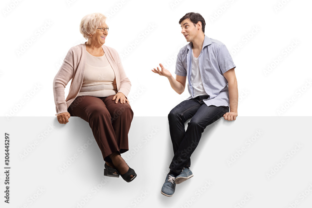 Grandmother and grandson sitting on a panel and having a conversation Grandmother and grandson sitting on a panel and having a conversation