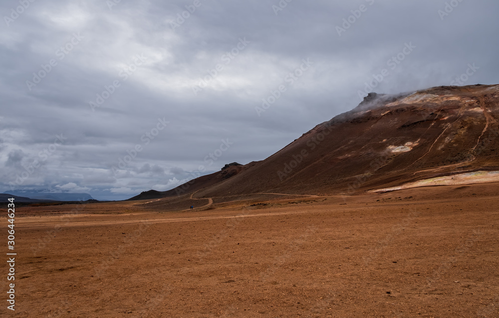 Hverir geothermal area in North Iceland. dy geysers and sulfur field. Orange mountains Iceland. Hverir geothermal area in North Iceland. dy geysers and sulfur field. Orange mountains Iceland.