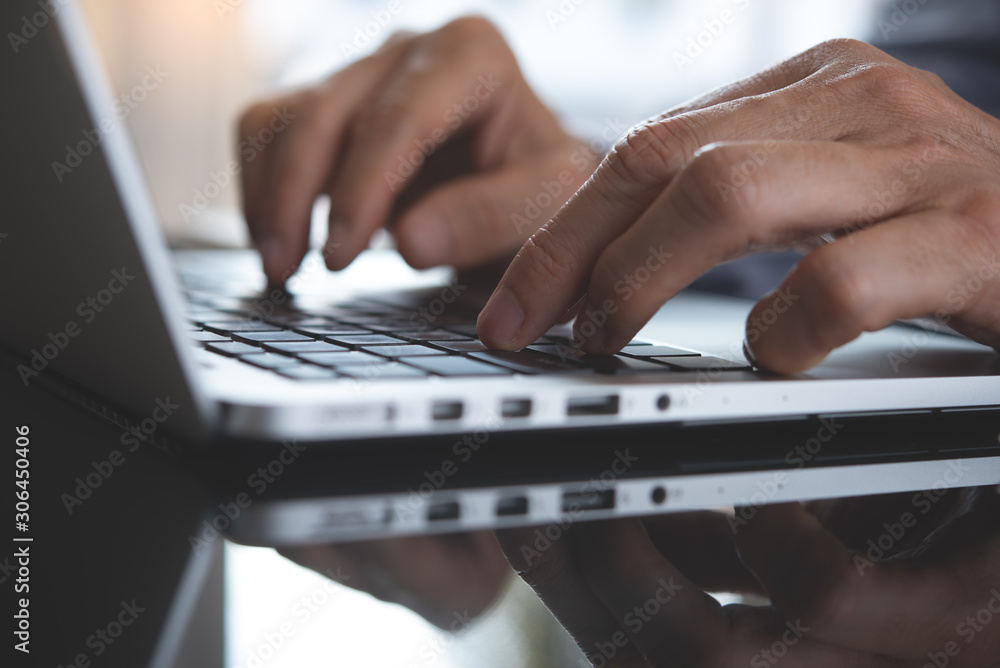 Businessman typing on laptop Businessman typing on laptop