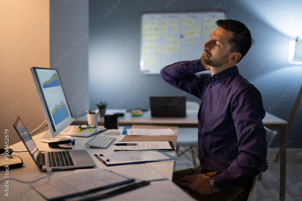 Businessman Suffering From Neck Pain Businessman Suffering From Neck Pain
