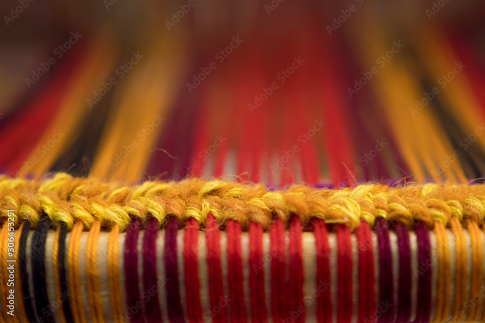 Manual wood loom. Hand loom background. Detail of traditional vintage