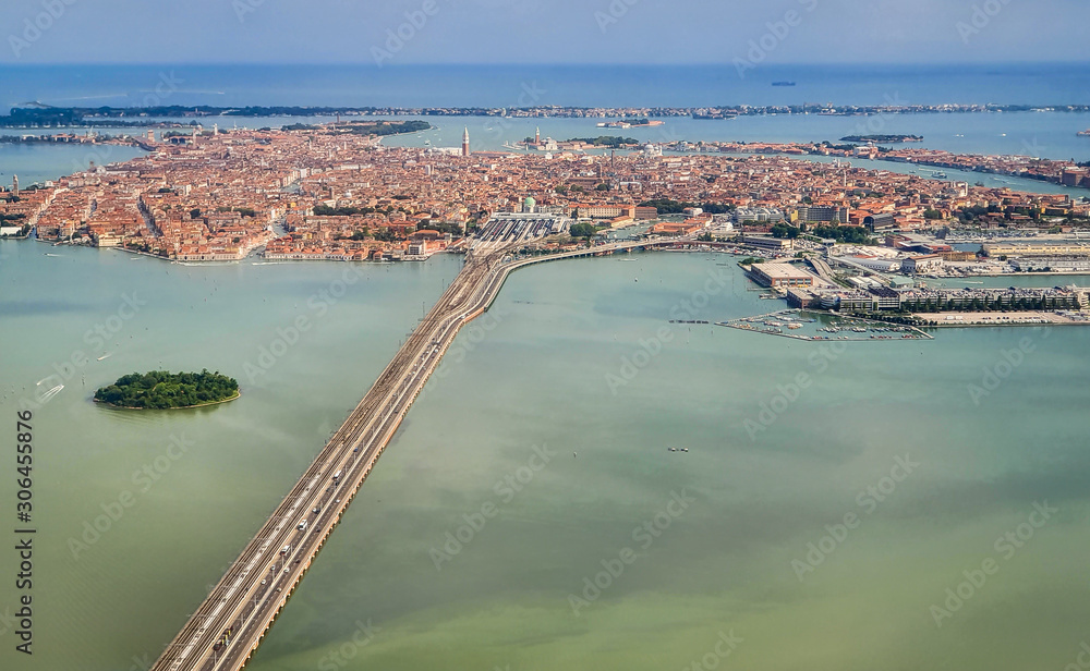 Venice, Italy - Panoramic aerial view. Top view of popular Venice on a sunny day from a window plane.