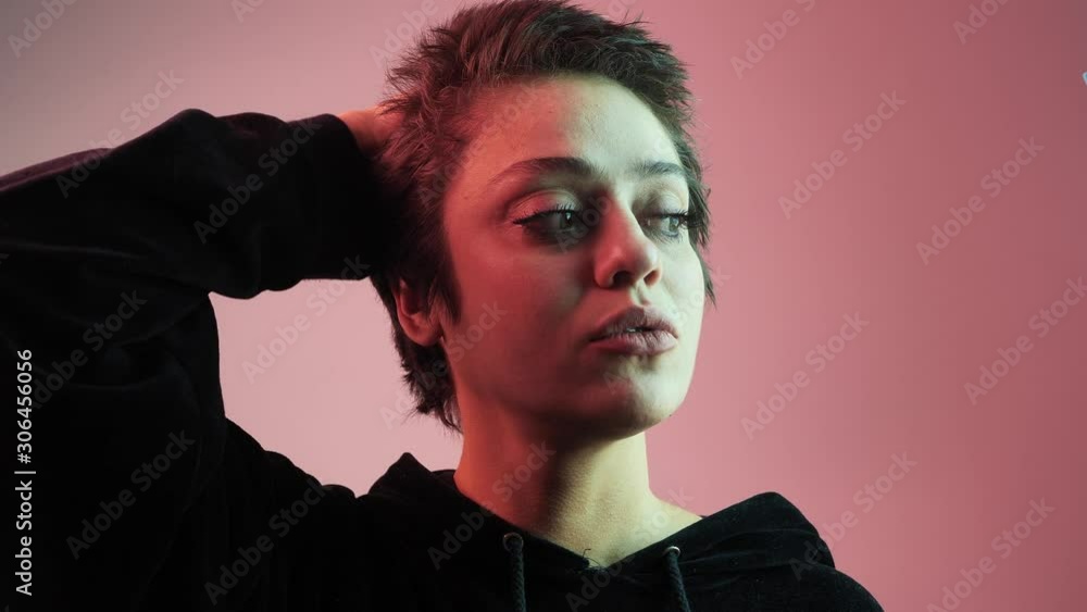 Naughty cute girl shows off her short hair, extravagant ripped hairstyle. The girl laughs sincerely, smiles. 4 k Naughty cute girl shows off her short hair, extravagant ripped hairstyle. The girl laughs sincerely, smiles. 4 k