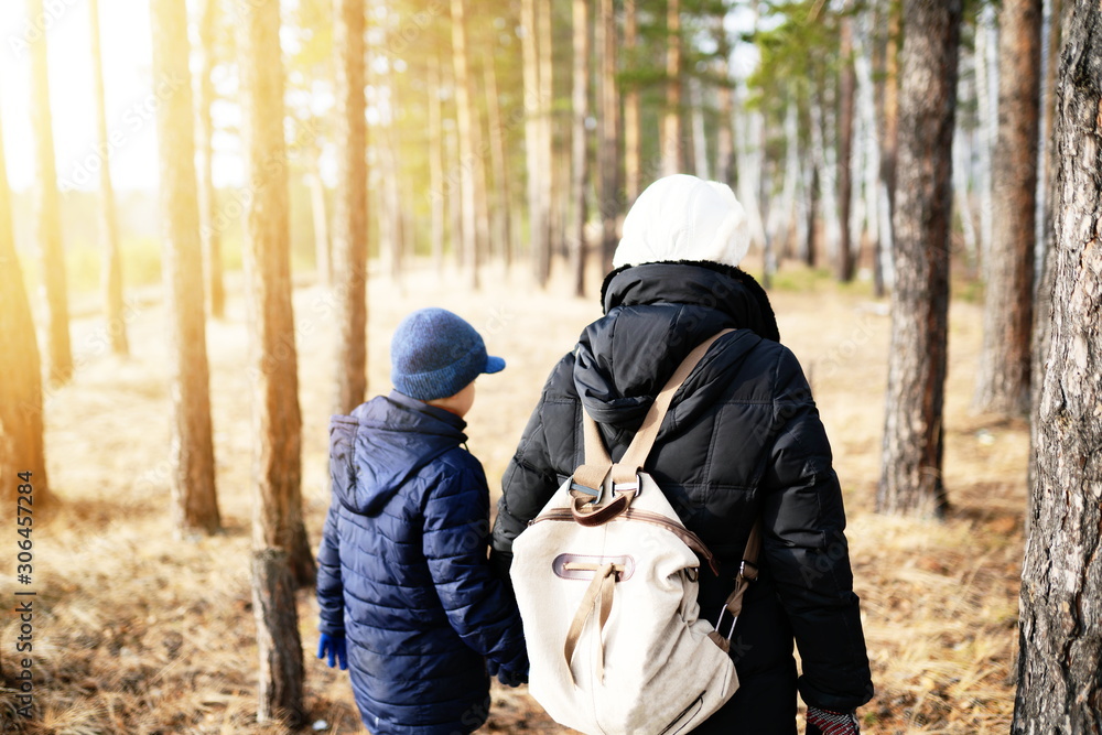 mother and son in forest