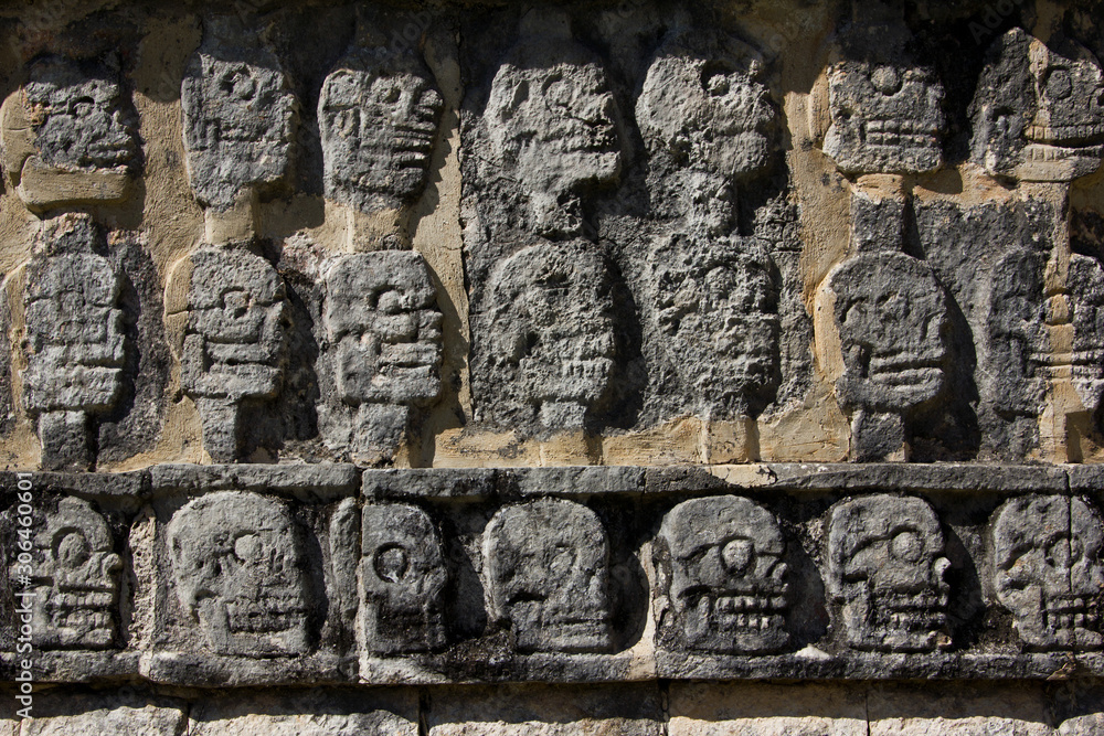 Skull Carvings on Wall of Ruins