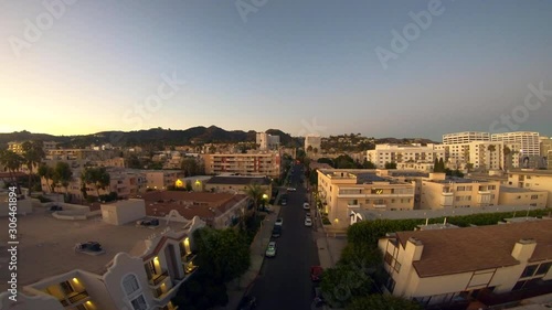 Rise up above Hollywood Apartments during Sunset in Los Angeles California 4K photo