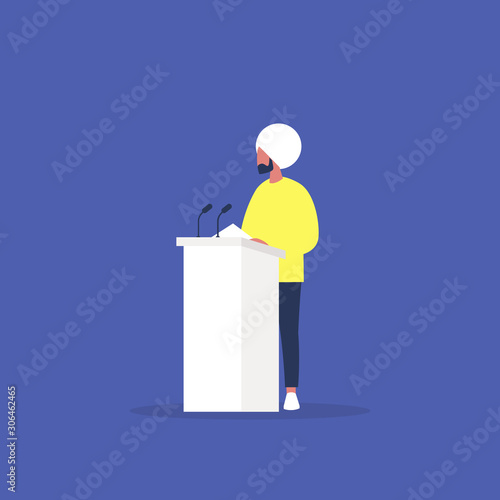 Political debate, young indian male speaker arguing behind the podium, freedom of speech