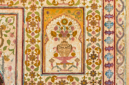A floral design on the wall of the Ganesh Pol at Amber Fort in Rajasthan, India.