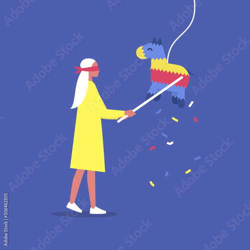 Young blindfolded male character hitting a colourful pinata with a stick, celebration party