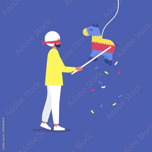 Young blindfolded indian male character hitting a colourful pinata with a stick, celebration party