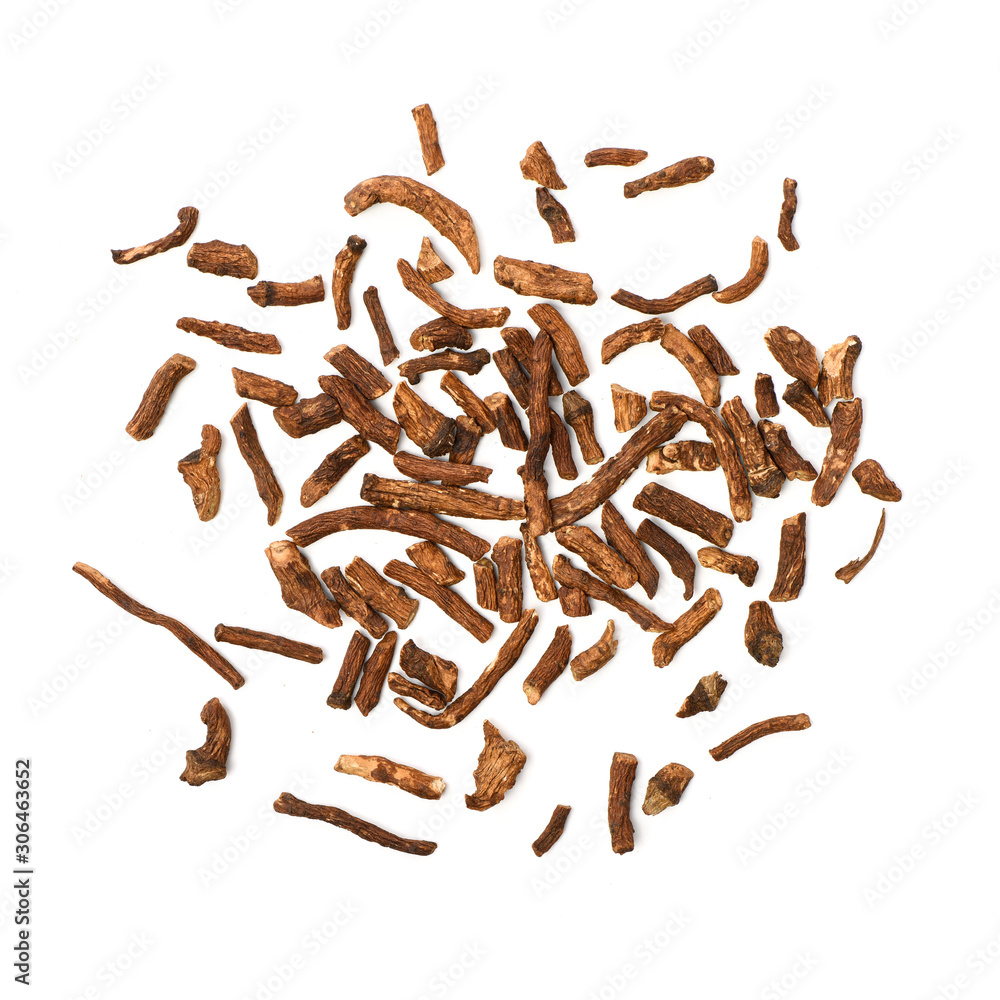 Dried medicinal herbs raw materials isolated on white. Root of Taraxacum, known as dandelions Dried medicinal herbs raw materials isolated on white. Root of Taraxacum, known as dandelions