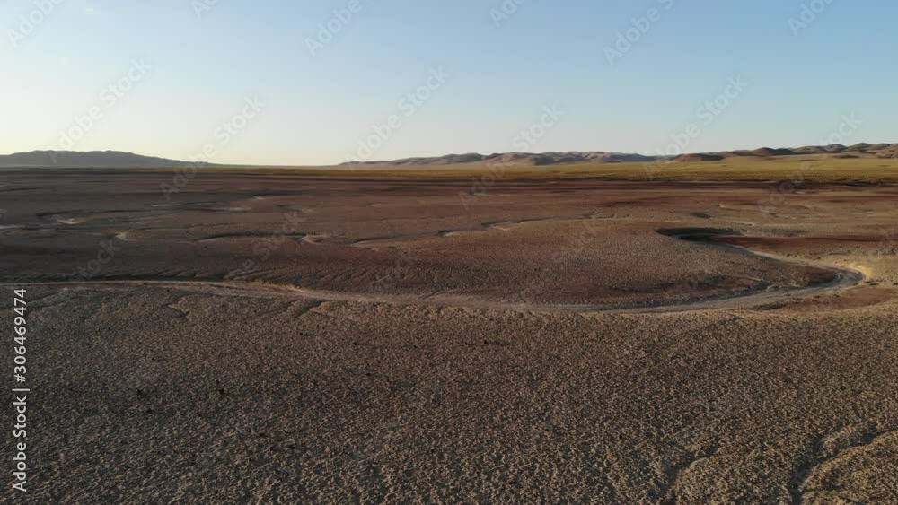 Drone video over empty salt flats with mountains at the edge Drone video over empty salt flats with mountains at the edge