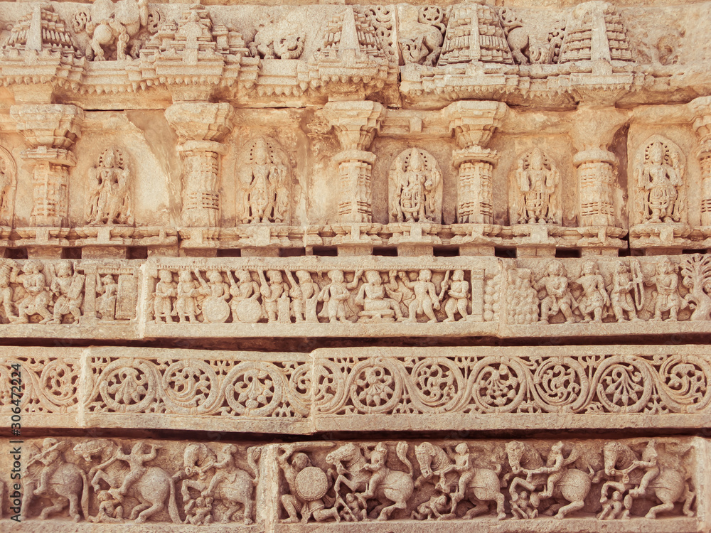 A wall covered in sculpted figures symbolising different historical events.