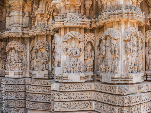 A wall covered in sculpted figures symbolising different historical events. photo