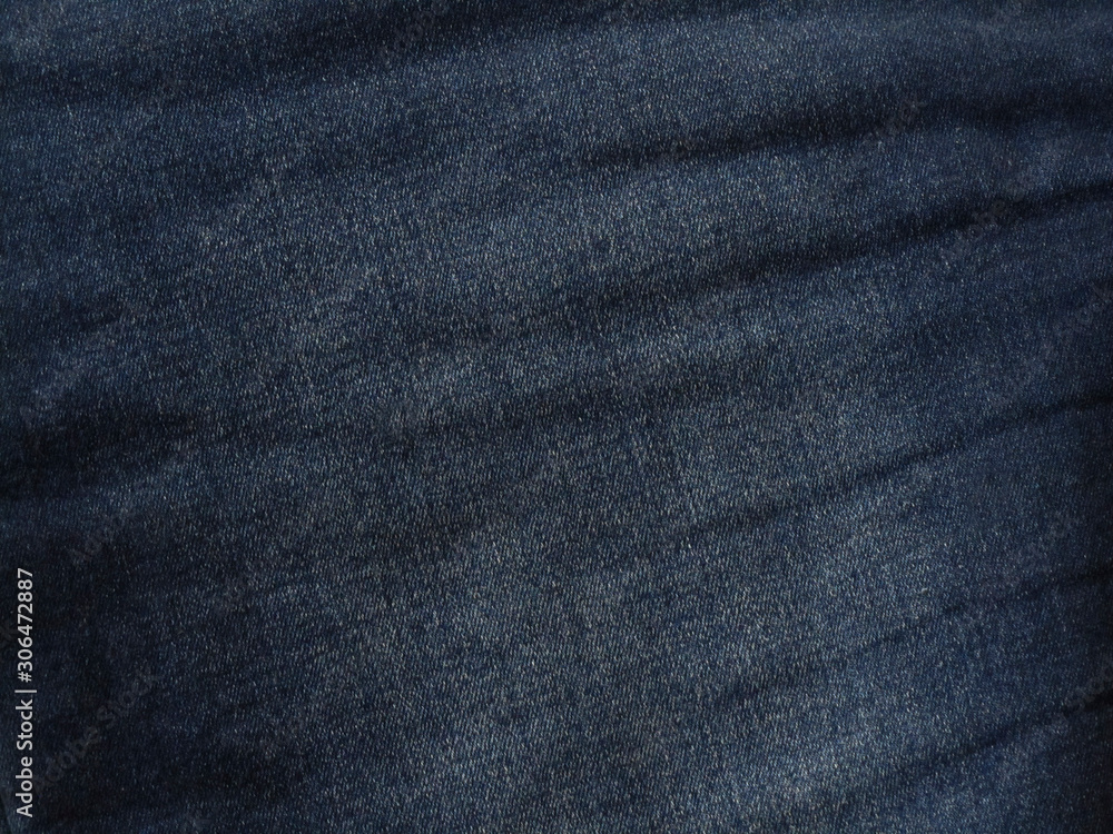 Navy blue grunge background. Dack denim texture. Texture of worn faded jeans. Old denim texture. Navy blue grunge background. Dack denim texture. Texture of worn faded jeans. Old denim texture.