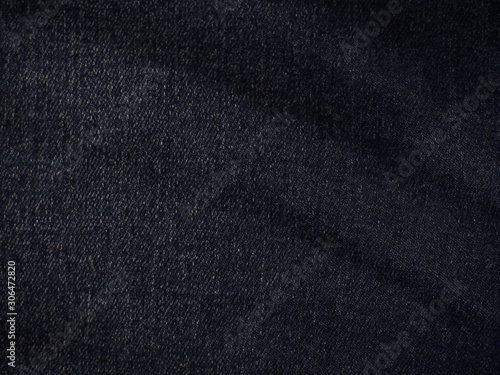 Black grunge background. Denim texture. Dark abstract denim background. Jeans background.