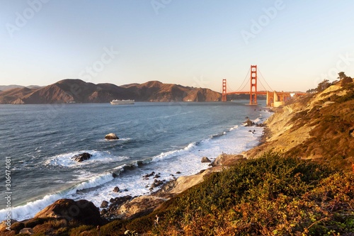 Golden Gate Bridge and Pacific ocean waves view from Marshal's beach in San Francisco California United States