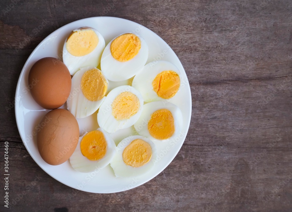 Sliced boiled eggs on wood table background. Sliced boiled eggs on wood table background.