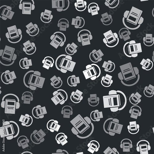 Grey Audio book icon isolated seamless pattern on black background. Book with headphones. Audio guide sign. Online learning concept. Vector Illustration