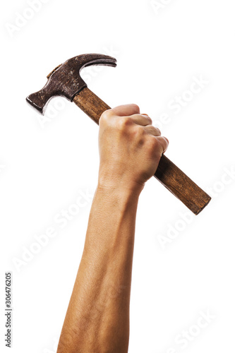 Fototapeta A hand raised up holds a hammer Isolated on a white background