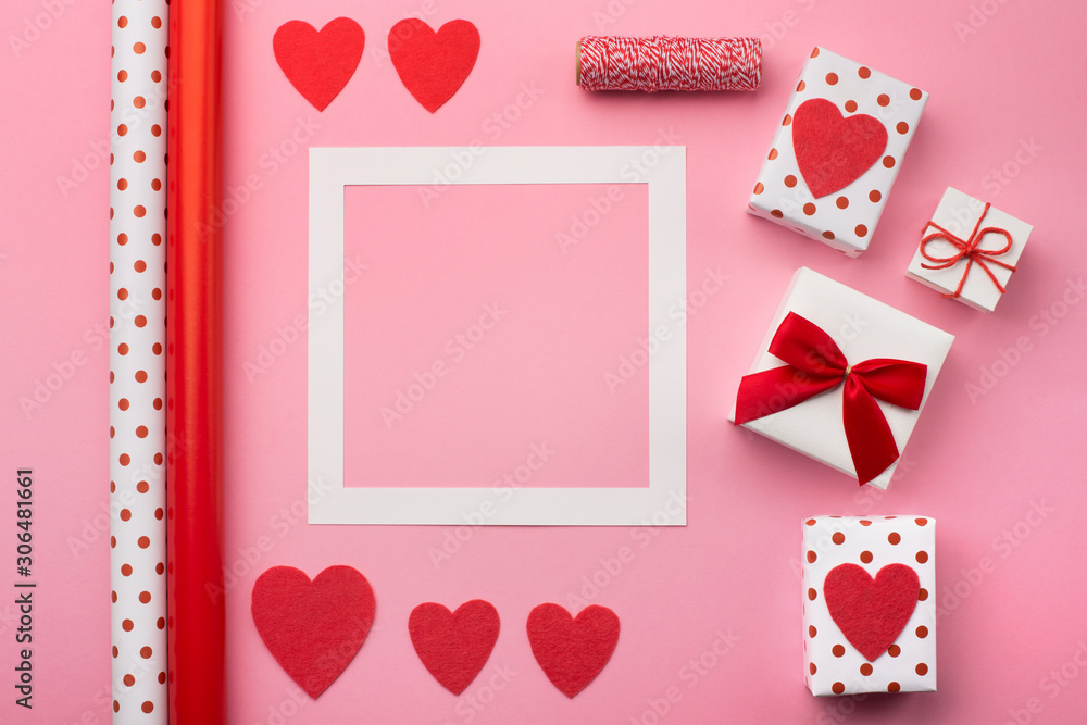 Valentines gift boxes, red bow and felt hearts
