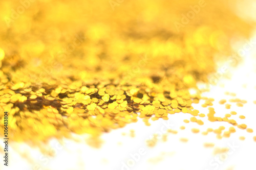 Gold glitter on white background. Celebratory Background. Golden Explosion Of Confetti.