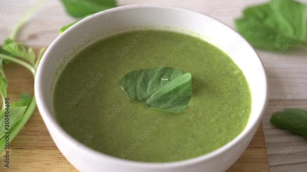 spinach soup bowl on wood table spinach soup bowl on wood table