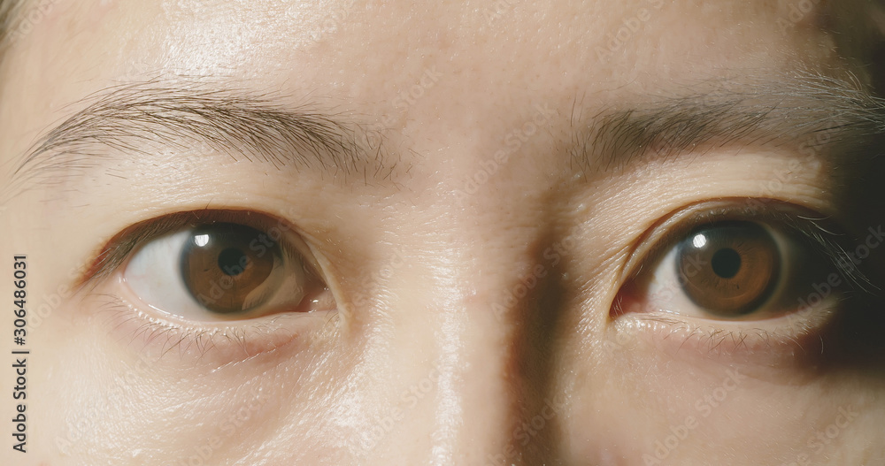 Fototapeta premium Macro shot of brown eye