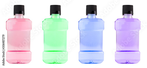 Картината върху платно A set of colored plastic bottles of water mouthwash isolated on white background
