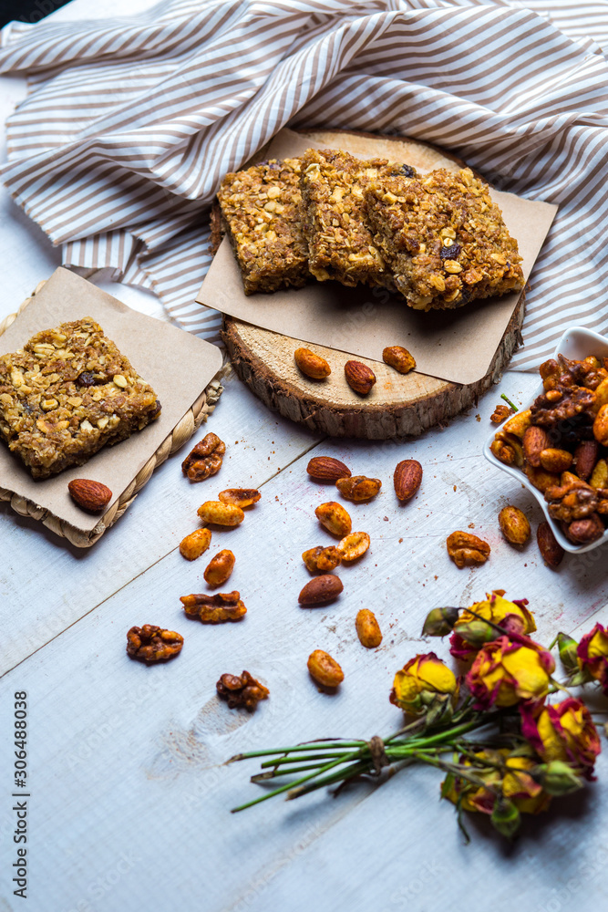 granola squares served with almond, walnut and pistachio